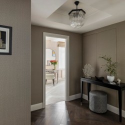 hallway with side table, wood floors and view to living room, Hyde Park Apartments, Mayfair, London W1
