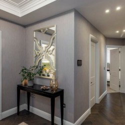 hallway with side table, artistic mirror, and doors to other rooms, Hyde Park Apartments, Mayfair, London W1