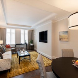 living room with sofa, chair, smart TV and dining table, Hyde Park Apartments, Mayfair, London W1