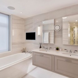 large bathroom with tub, 2 sinks, 2 mirrors and TV, Hyde Park Apartments, Mayfair, London W1