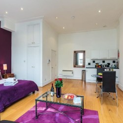 double studio with bed, coffee table, dining table and kitchen, Longridge Apartments, Kensington, London SW5