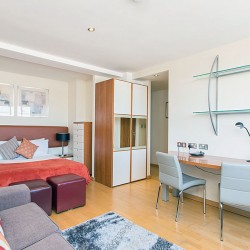 studio with sofa, work desk, double bed and wardrobe, Old Brompton Apartments, Kensington, London SW5