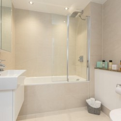 bathroom with sink, bathtub and shower, toiletries and WC, Portobello Road Apartments, Notting Hill, London W10