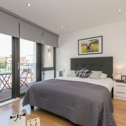 bedroom with double bed and balcony with furniture, Portobello Road Apartments, Notting Hill, London W10