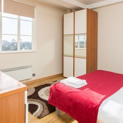 bedroom with double bed, wardrobe and drawers, Old Brompton Apartments, Kensington, London SW5