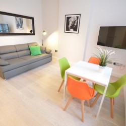 living area with double sofa bed and dining table, Anne’s Apartments, Soho, London W1