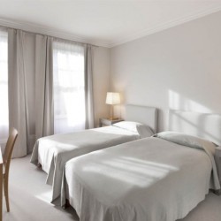 bedroom with 2 single beds and work desk, Hertford Apartments, Mayfair, London