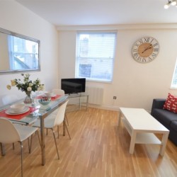 studio, living room with double sofa bed and dining table, Greek Street Studios, Soho, London