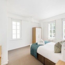 light bedroom with double bed and wardrobe, Pimlico Corporate Apartments, Pimlico, London SW1