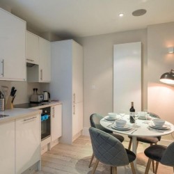 kitchen with dining area and standing lamp, Goodge Street Apartments, Fitzrovia, London W1