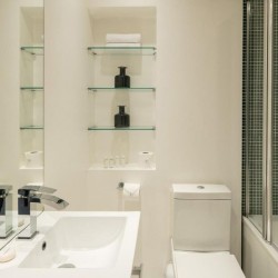 bathroom with sink, toilet, shelves and bathtub, Goodge Street Apartments, Fitzrovia, London W1