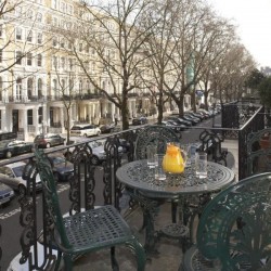 balcony with seating and pitcher with orange juice, Beaufort Apartments, Knightsbridge, London SW3