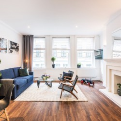 living room with sofa, chairs, dining table and kitchen, Greek Street Apartments, Soho, London