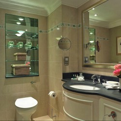 bathroom with sink, mirror and flowers, Knightsbridge Apartments, Knightsbridge, London SW3