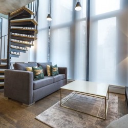 mezzanine apartment with staircase, sofa and coffee table, Bourchier Apartments, Soho, London