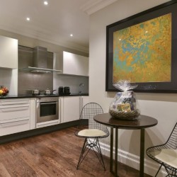 kitchen and seating area, welcome pack and wall art, Stanhope Luxury Homes, Kensington, London SW7