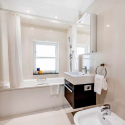 bathroom with shower over bathtub, kensington, london