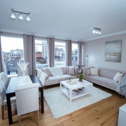 living room with large sofas and dining area, Edgware Road Apartments, Marylebone, London W1