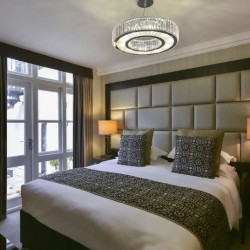 bedroom with king size bed and side lamps, Stanhope Luxury Homes, Kensington, London SW7