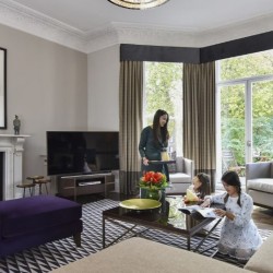 large living room with parent and children, Stanhope Luxury Homes, Kensington, London SW7