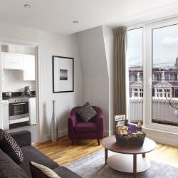 apartment with sofa, chair, view to kitchen and balcony, South Kensington Luxury, Kensington, London SW7