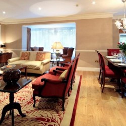red chairs, sofa, part of dining area, Knightsbridge Apartments, Knightsbridge, London SW3