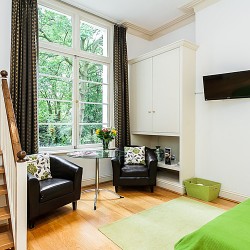 double studio with stairs and dining table, Longridge Apartments, Kensington, London SW5