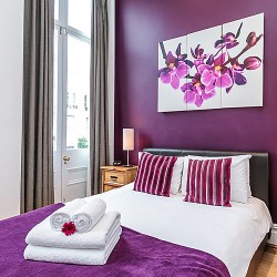 double bed with towels, Longridge Apartments, Kensington, London SW5