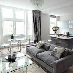 living area with dining table and kitchen, Welbeck Apartments, Marylebone, London