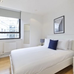 double bedroom with side table, Court Apartments, Holborn, London EC4