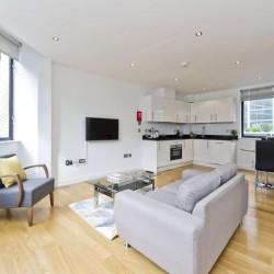 living area with sofa, chair, tv and kitchen, Court Apartments, Holborn, London EC4