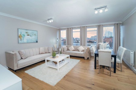 living room with beige sofas and dining table, Edgware Road Apartments, Marylebone, London W1