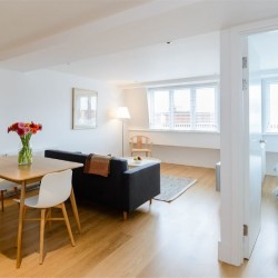living area with wood floors, dining table, sofa and view to bedroom, Fulham Apartments, Fulham, London SW6