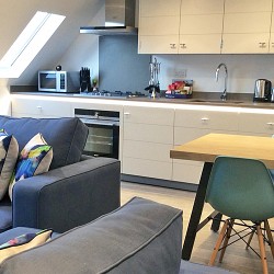 living area with kitchen and dining table, Rathbone Apartments, Fitzrovia, London W1