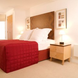 bedroom with double bed and side table, Limehouse Apartments, Limehouse, London E1
