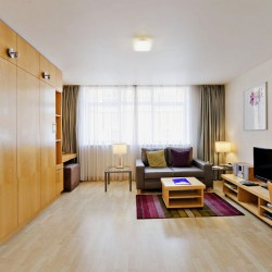 studio with fold down bed, sofa, tv and part of dining table, Oxford Street Apartments, Marylebone, London W1