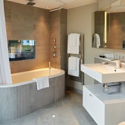 luxury bathroom with tv in in Luxury Penthouses, Tower Hill, London