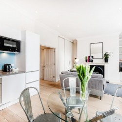 living are with kitchen, dining table and sofa, Wardour Executive Apartments, Soho, London