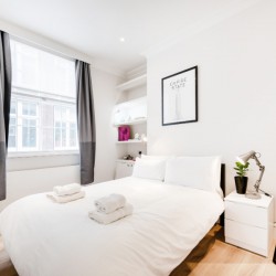 double bedroom with wood floors, Wardour Executive Apartments, Soho, London