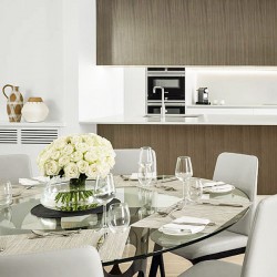 dressed dining table with flowers and kitchen, Hertford Apartments, Mayfair, London W1