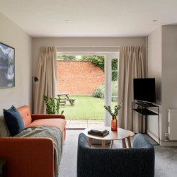 living room with sofa, chair, table, tv and view to the garden, Castle Apartments, Reading, Berkshire RG1