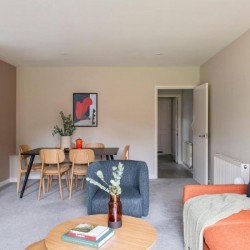 bright living room with sofa, coffee table, chair and dining area, Castle Apartments, Reading, Berkshire RG1