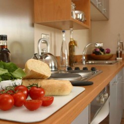 kitchen with tomatoes, bread, salad and oils, Bristol Serviced Apartments, Bristol BS1