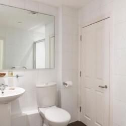 modern bathroom with large mirror, sink and WC, Bristol Serviced Apartments, Bristol BS1