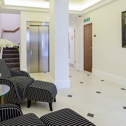 lobby area with stairs and lift