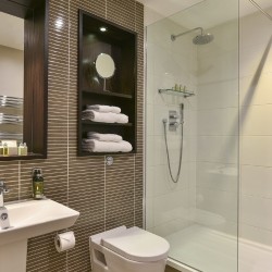 bathroom with sink, toilet, mirror and walk in shower, Queen's Apart Hotel, Kensington, London SW7