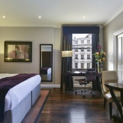studio with king bed, mirror, work desk and dining table, Queen's Apart Hotel, Kensington, London SW7