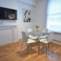 dining table and flat screen TV, Wardour Serviced Apartments, Soho, London