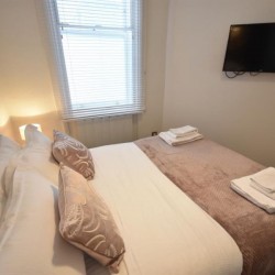 double bedroom with TV, Wardour Serviced Apartments, Soho, London