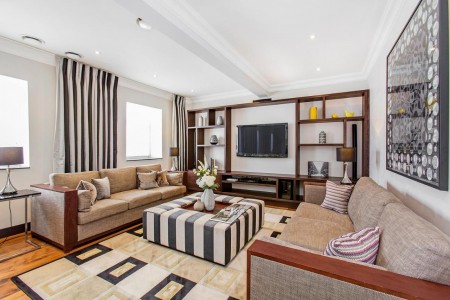 sofas, coffee table, large display wall with smart tv, Queens Luxury Apartments, Kensington, London SW7